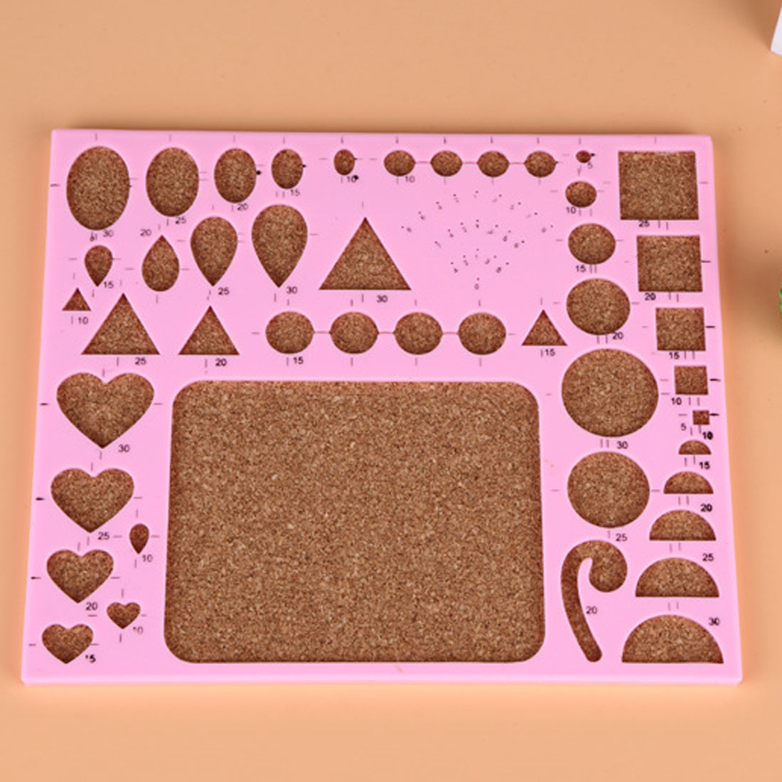 Pink stencil template with various shapes for precise cutting in Monochrome Paper Craft Kit by Arts And More